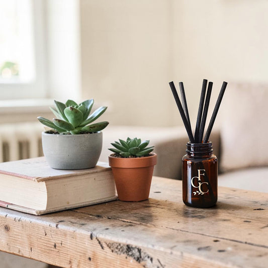 Reed diffuser with black reeds styled in a Mediterranean home